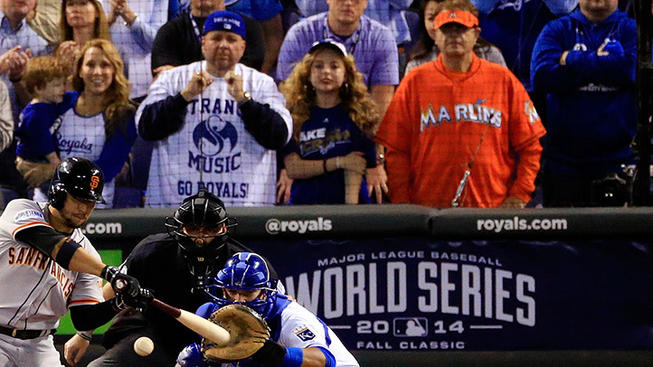 guy with marlins jersey behind home plate