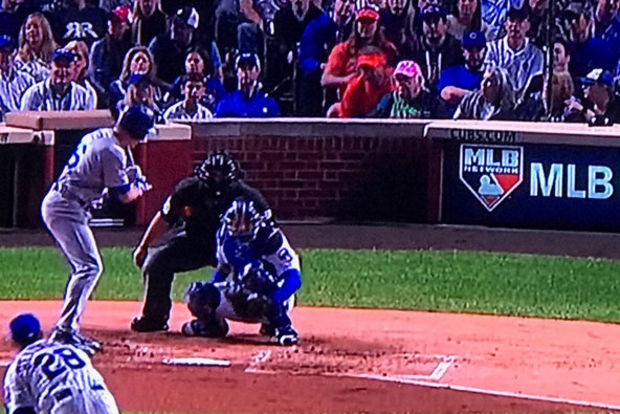 Guy in pink store hat at wrigley field