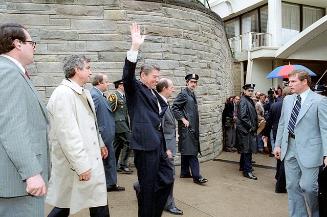 640px-President_Ronald_Reagan_moments_before_he_was_shot_in_an_assassination_attempt_1981